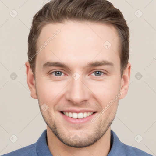 Joyful white young-adult male with short  brown hair and grey eyes