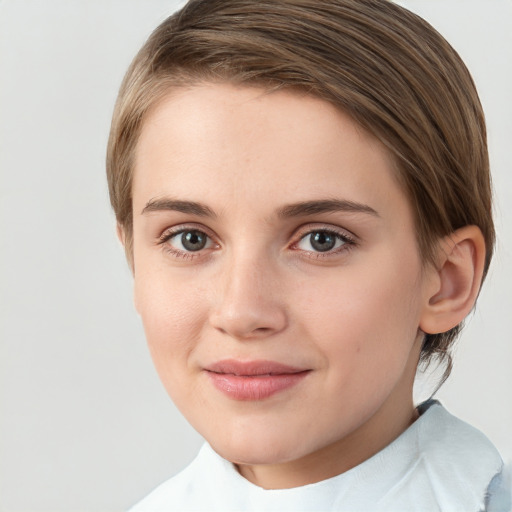 Joyful white young-adult female with medium  brown hair and green eyes