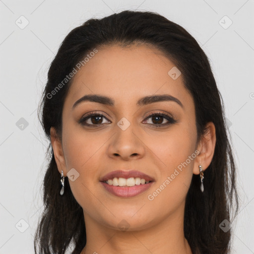 Joyful latino young-adult female with long  brown hair and brown eyes