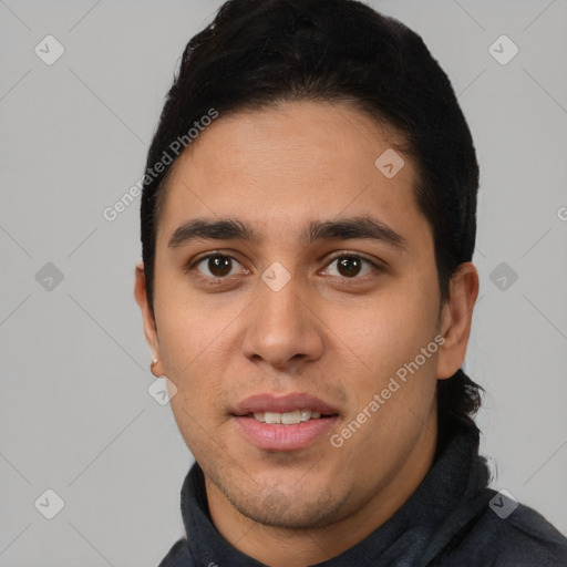 Joyful white young-adult male with short  black hair and brown eyes