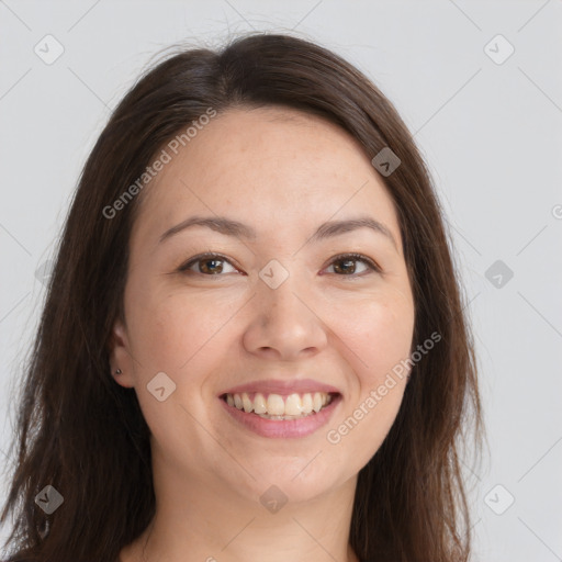 Joyful white young-adult female with long  brown hair and brown eyes