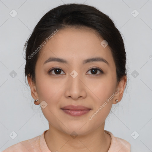 Joyful asian young-adult female with medium  brown hair and brown eyes