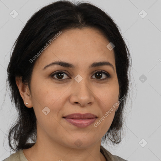 Joyful latino young-adult female with medium  brown hair and brown eyes