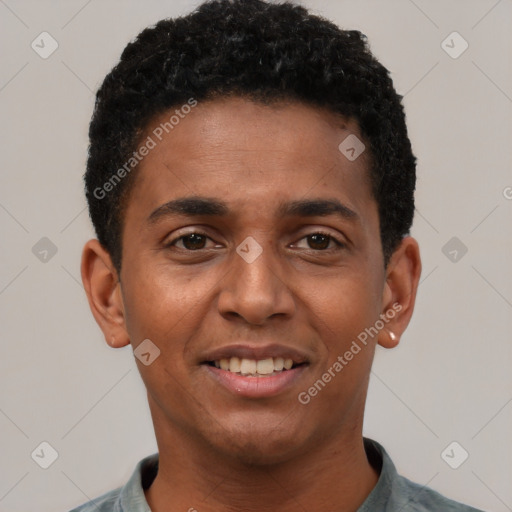 Joyful black young-adult male with short  black hair and brown eyes