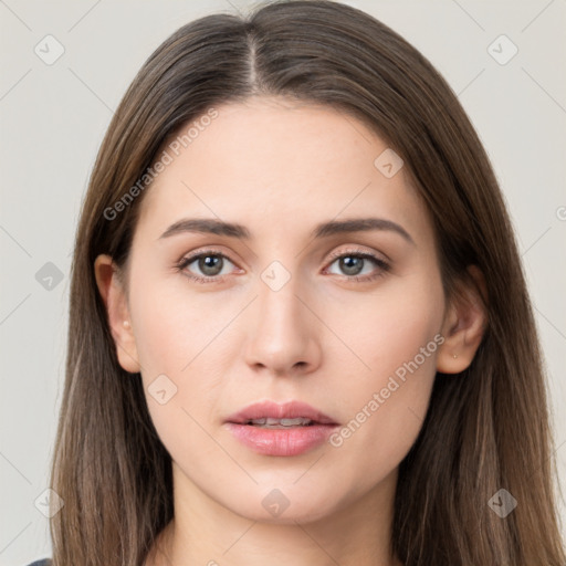 Neutral white young-adult female with long  brown hair and brown eyes