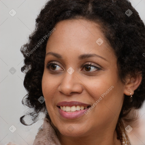 Joyful black young-adult female with long  brown hair and brown eyes