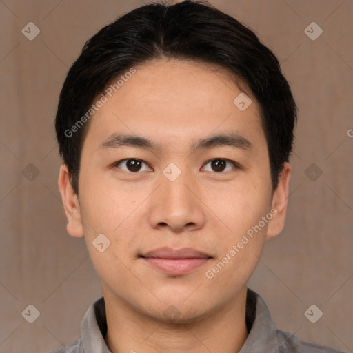 Joyful asian young-adult male with short  brown hair and brown eyes