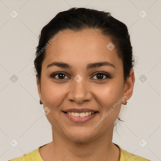 Joyful latino young-adult female with short  brown hair and brown eyes