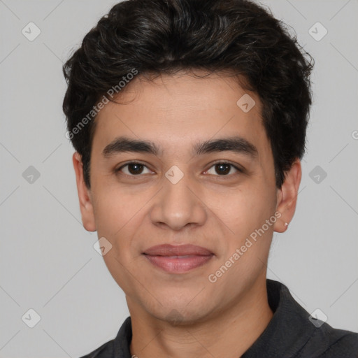 Joyful white young-adult male with short  black hair and brown eyes