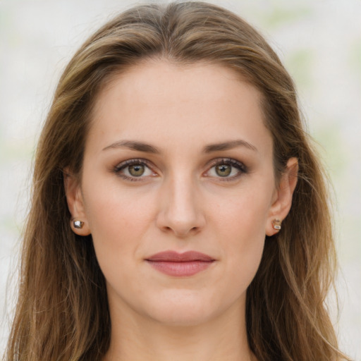 Joyful white young-adult female with long  brown hair and green eyes