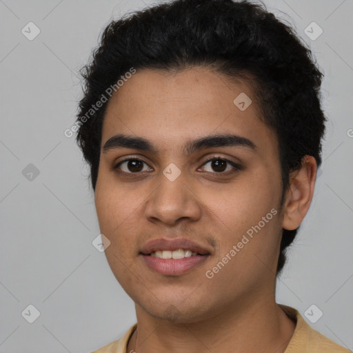 Joyful latino young-adult male with short  black hair and brown eyes