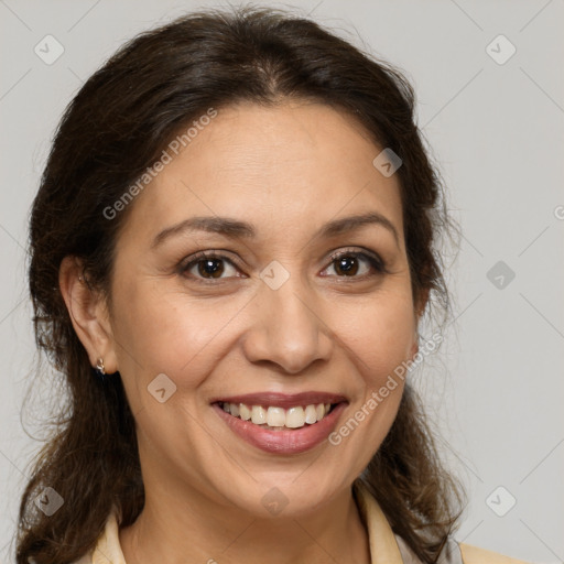 Joyful white adult female with medium  brown hair and brown eyes