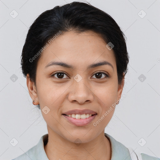 Joyful latino young-adult female with medium  brown hair and brown eyes