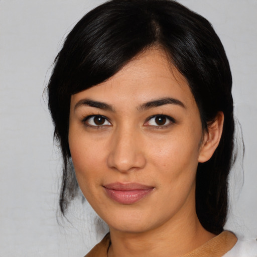 Joyful asian young-adult female with medium  black hair and brown eyes