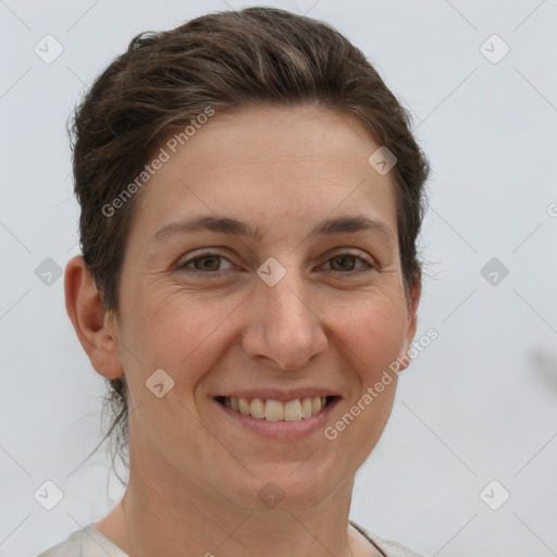 Joyful white adult female with short  brown hair and brown eyes