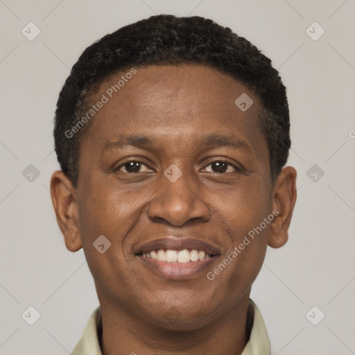 Joyful black young-adult male with short  brown hair and brown eyes