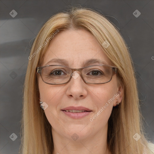 Joyful white adult female with long  brown hair and brown eyes