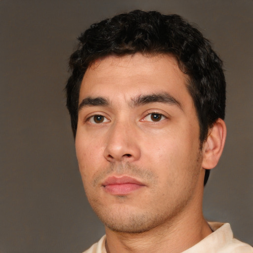 Neutral white young-adult male with short  black hair and brown eyes