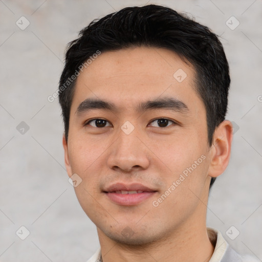 Joyful asian young-adult male with short  black hair and brown eyes