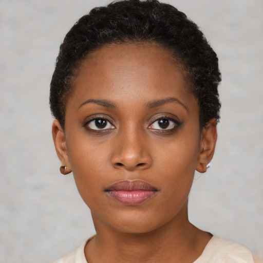 Neutral black young-adult female with short  brown hair and brown eyes