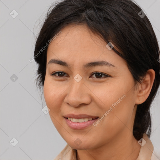 Joyful asian young-adult female with medium  brown hair and brown eyes