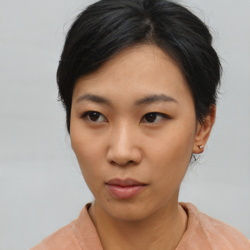 Neutral asian young-adult female with medium  black hair and brown eyes