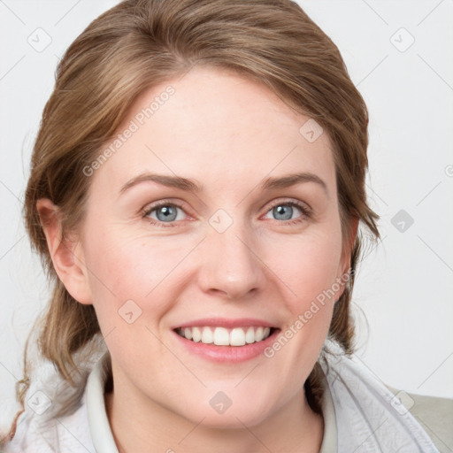 Joyful white young-adult female with medium  brown hair and blue eyes