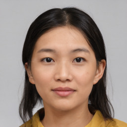 Neutral asian young-adult female with medium  brown hair and brown eyes