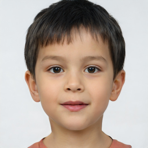 Joyful white child male with short  brown hair and brown eyes