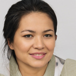 Joyful asian young-adult female with medium  brown hair and brown eyes