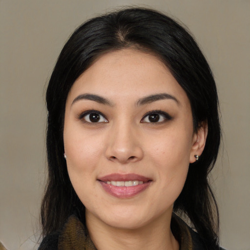 Joyful white young-adult female with medium  black hair and brown eyes