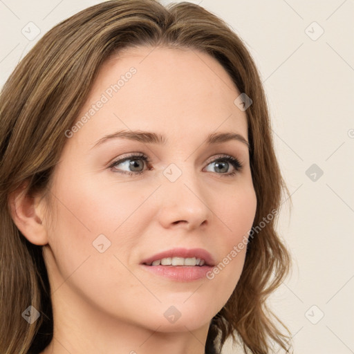 Joyful white young-adult female with long  brown hair and green eyes