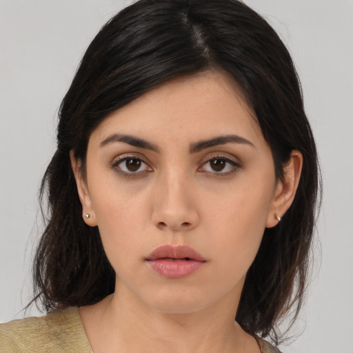 Neutral asian young-adult female with medium  brown hair and brown eyes