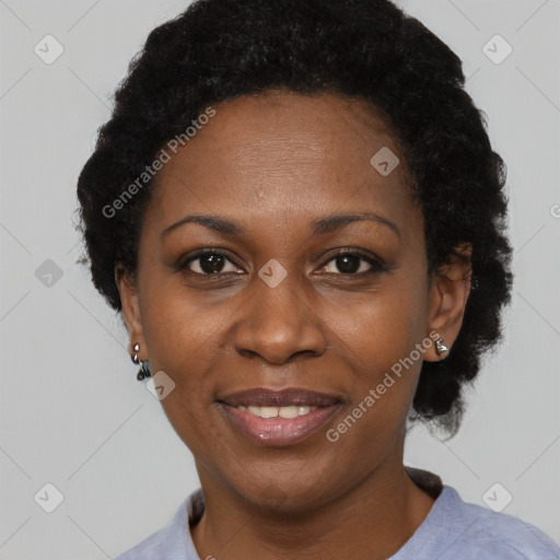 Joyful black adult female with short  black hair and brown eyes