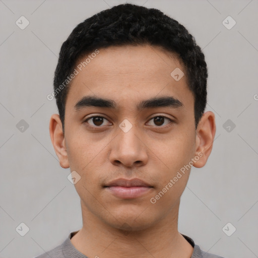 Neutral latino young-adult male with short  black hair and brown eyes
