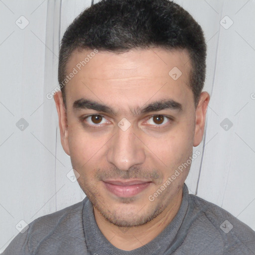 Joyful white young-adult male with short  brown hair and brown eyes