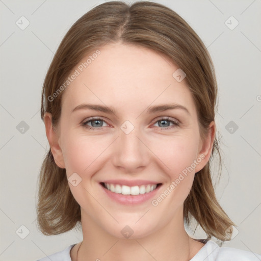 Joyful white young-adult female with medium  brown hair and blue eyes