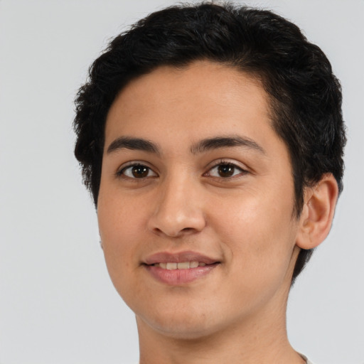 Joyful latino young-adult female with short  brown hair and brown eyes