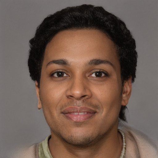 Joyful latino young-adult male with short  brown hair and brown eyes