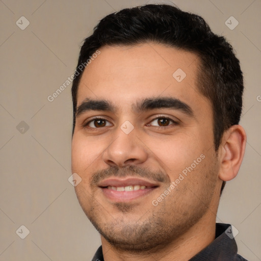 Joyful white young-adult male with short  black hair and brown eyes