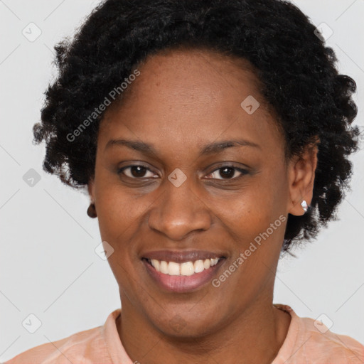 Joyful latino adult female with short  brown hair and brown eyes