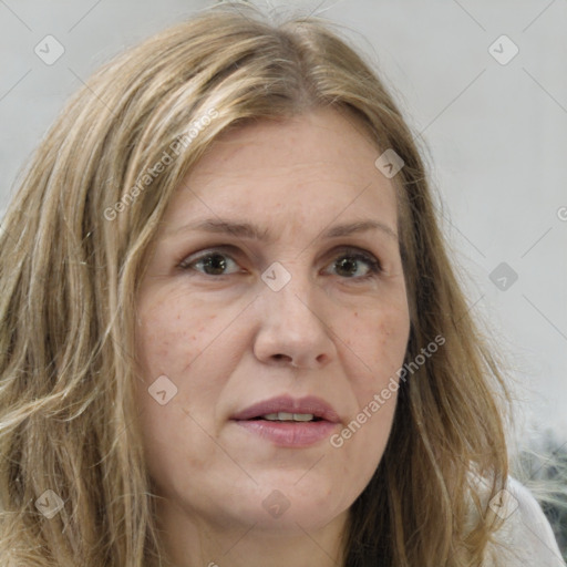 Joyful white adult female with long  brown hair and brown eyes