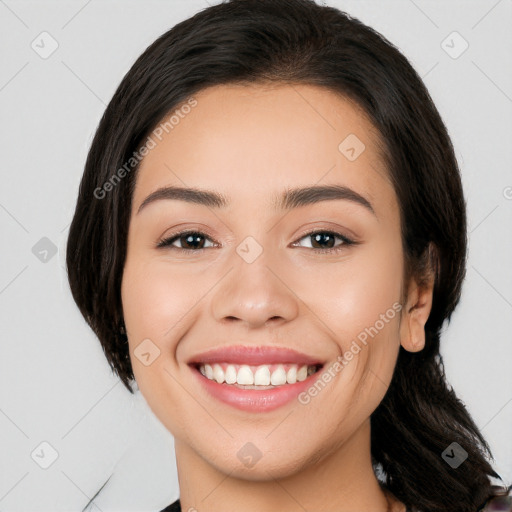 Joyful white young-adult female with medium  black hair and brown eyes