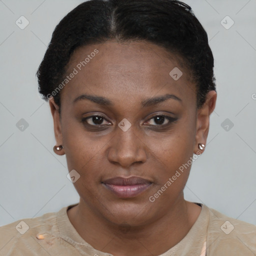 Joyful black young-adult female with short  brown hair and brown eyes