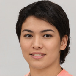 Joyful asian young-adult female with short  brown hair and brown eyes