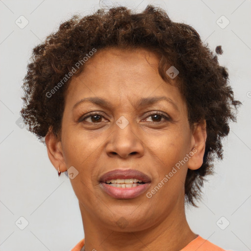 Joyful black adult female with short  brown hair and brown eyes