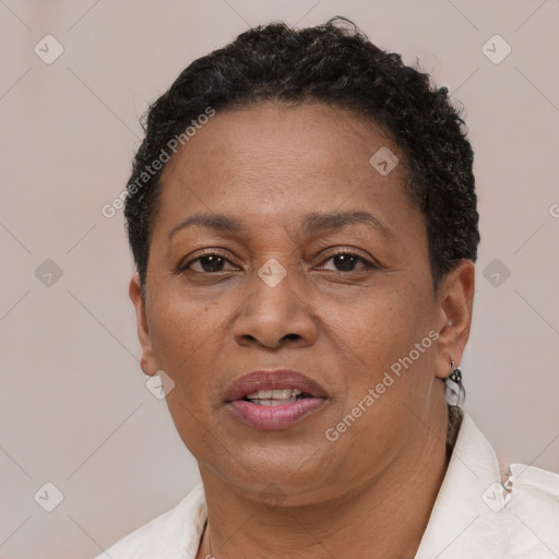 Joyful black adult female with short  brown hair and brown eyes