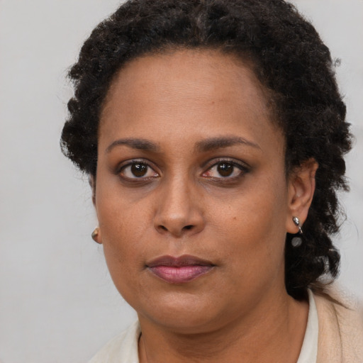 Neutral black young-adult female with short  brown hair and brown eyes