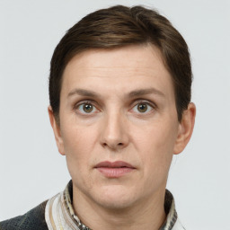 Joyful white adult male with short  brown hair and grey eyes