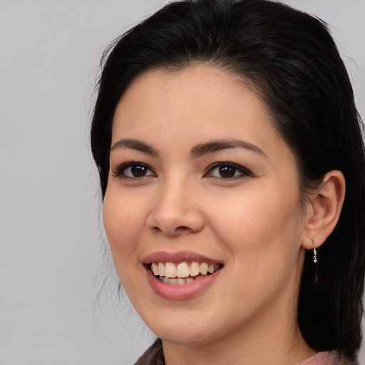 Joyful asian young-adult female with medium  black hair and brown eyes